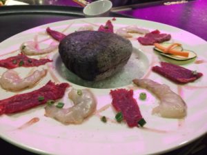 Searing Wagyu on River Stones Denver Food Tour